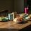 Healthy Texas breakfast table featuring six colorful dishes to break your fast — avocado toast, yogurt parfait, wraps, quinoa bowls, rice bowls, and smoothies — set in warm morning light with coffee mugs and rustic charm.