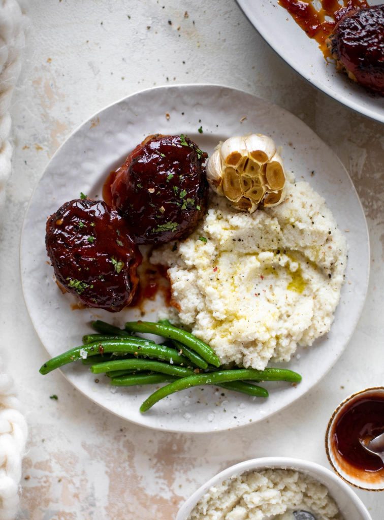 plate of Mini Turkey Meatloaf's with mashed potatoes and green beans.