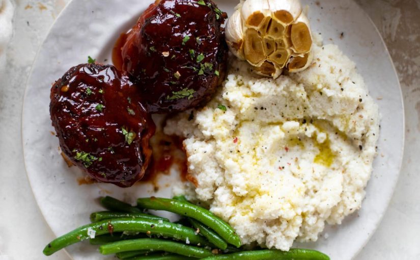 plate of Mini Turkey Meatloaf's with mashed potatoes and green beans.