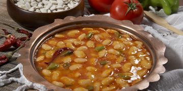 Tex-Mex pinto beans and broth in bowl