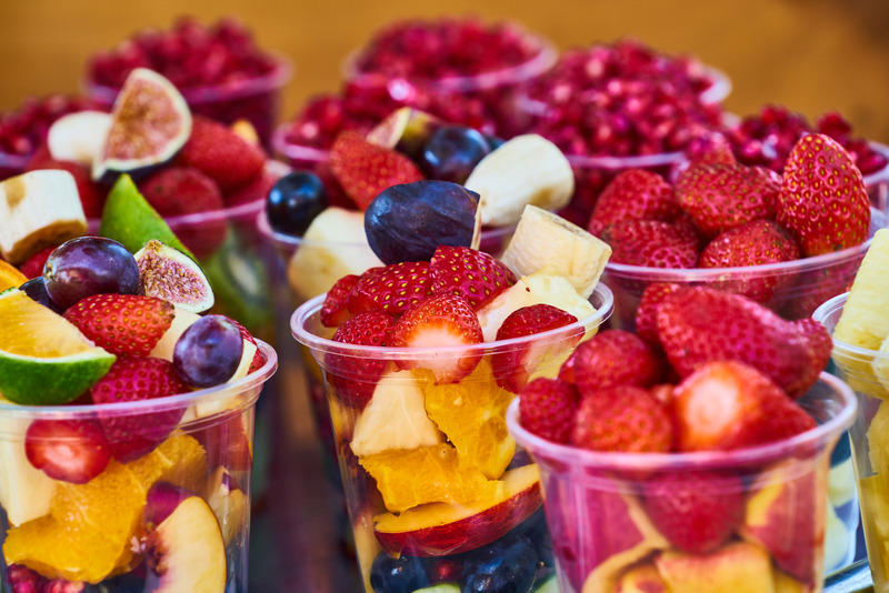 chopped fruit in plastic cups