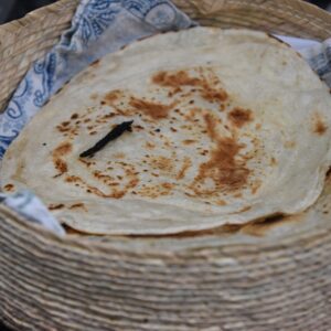 homemade flour tortillas in woven basket