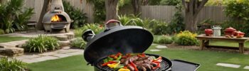 Kettle charcoal grill in green grass covered backyard, grilling fajitas.