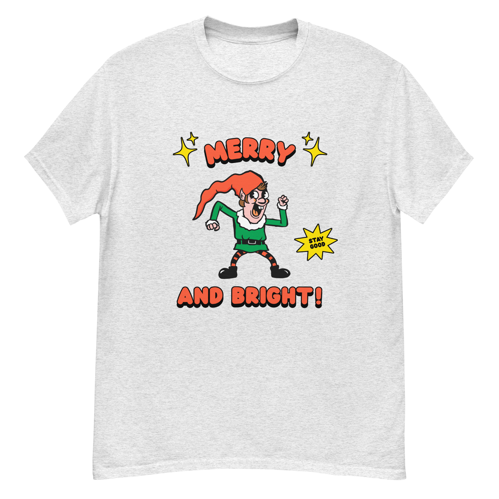 White T shirt with a retro-style elf character with a red hat, green suit, and black boots. The elf is striking a playful pose with a "Stay Good" speech bubble.