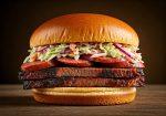 El Jefe Hill Country BBQ Brisket Sausage Coleslaw Sandwich on Kitchen Counter