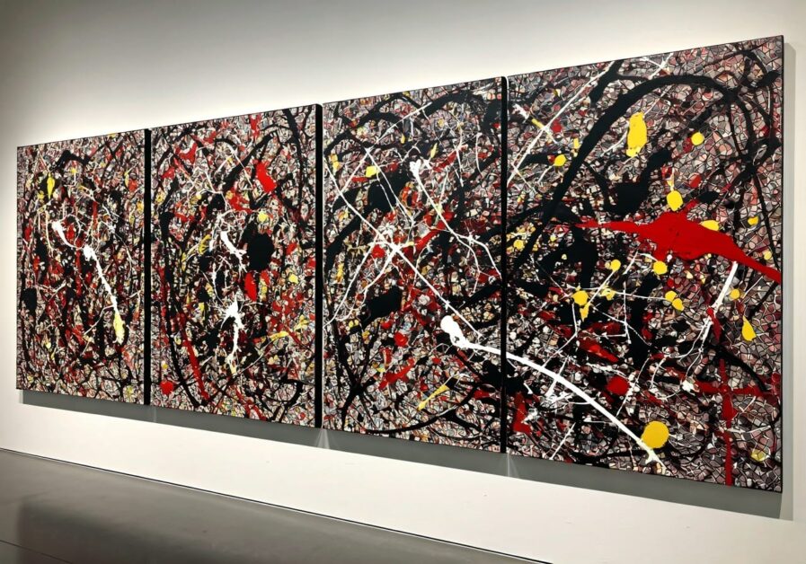Jackson Pollock-inspired series of paintings on the wall of an art gallery.